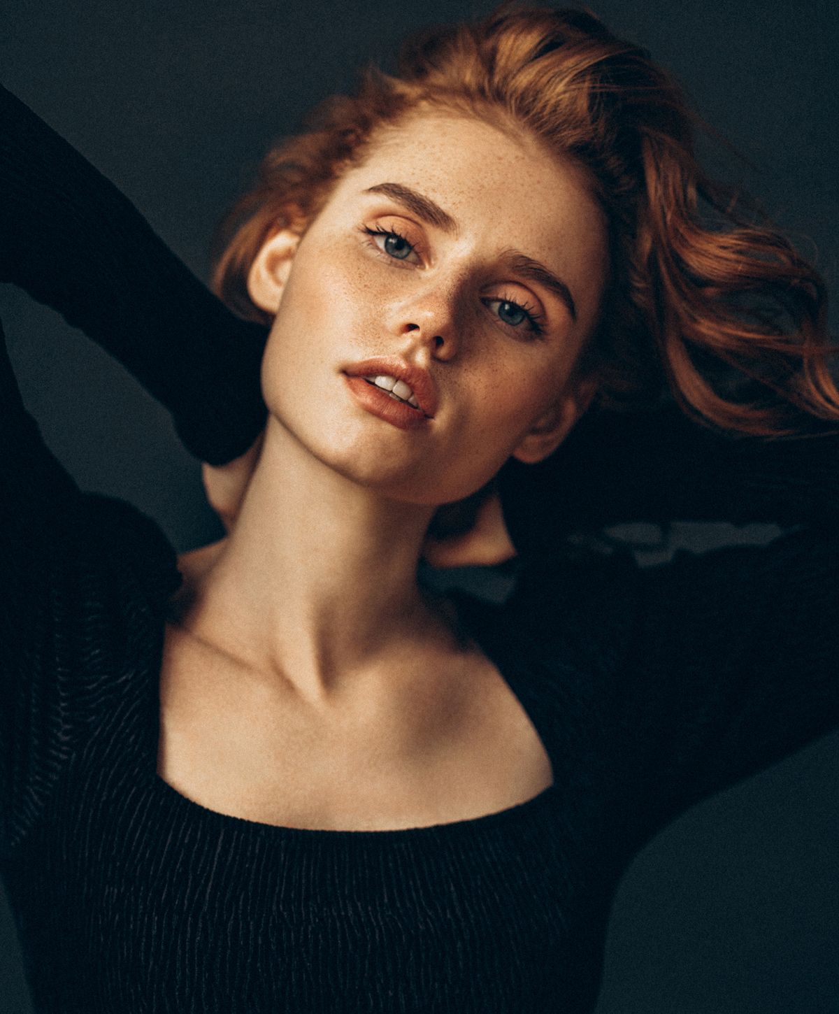 Close-up of woman with red hair and freckles.