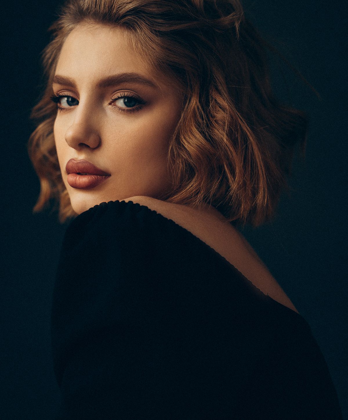 Portrait of a woman with soft curls.