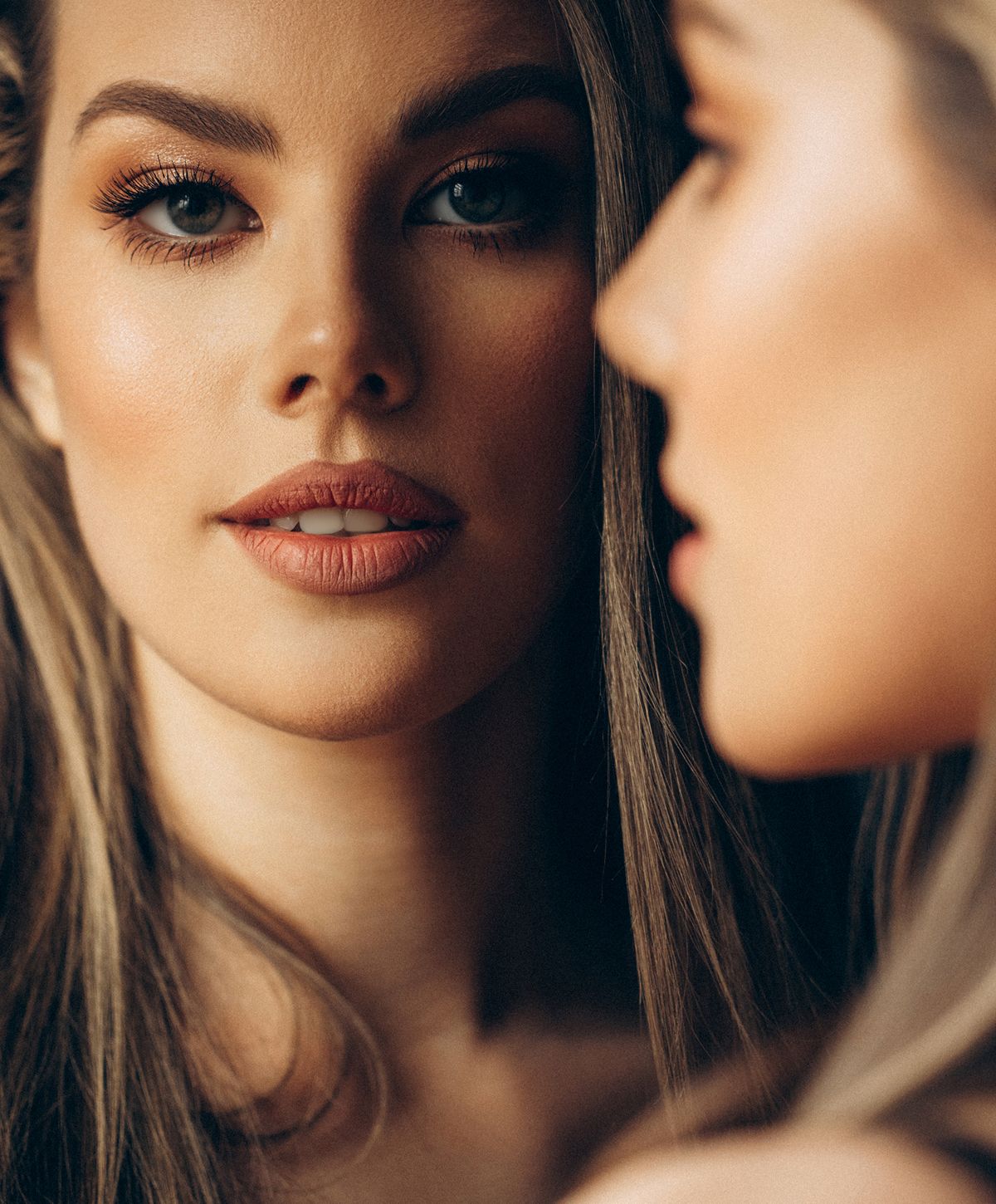 Close-up of two women with soft expressions.